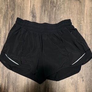 Lululemon black 4” low rise hotty hot shorts